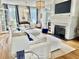 Cozy living room with a fireplace, large windows, and comfortable seating, ideal for Gathering gatherings at 1075 Avenue Of Oaks, Charleston, SC 29407