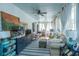 Bright living room with a ceiling fan, light-colored walls, and neutral furniture at 1075 Avenue Of Oaks, Charleston, SC 29407