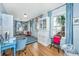 Bright office featuring hardwood floors, blue accents, and ample natural light at 1075 Avenue Of Oaks, Charleston, SC 29407