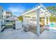 Charming outdoor patio with a pergola, dining area, grill, and seating, perfect for entertaining and outdoor gatherings at 1075 Avenue Of Oaks, Charleston, SC 29407