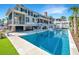 Luxurious backyard pool with sun loungers and manicured landscaping at 1075 Avenue Of Oaks, Charleston, SC 29407