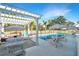 Beautiful outdoor space with a pool, lounge chairs, umbrellas, and a pergola-covered dining area for relaxation and entertainment at 1075 Avenue Of Oaks, Charleston, SC 29407