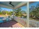 Relaxing screened porch overlooking a backyard with pool and lounge area at 1075 Avenue Of Oaks, Charleston, SC 29407
