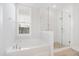Clean bathroom featuring a soaking tub and glass-enclosed shower at 113 Grimball St, Summerville, SC 29486