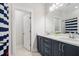 The bathroom features a double vanity, well-lit mirror, and tiled floor at 113 Grimball St, Summerville, SC 29486