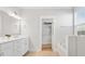 Bright bathroom with double sink vanity, soaking tub, and walk-in closet at 113 Grimball St, Summerville, SC 29486