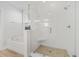 Bright bathroom features white subway tile shower with glass surround and separate soaking tub near a window at 113 Grimball St, Summerville, SC 29486
