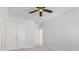 Bright bedroom boasts neutral carpet, a ceiling fan, and multiple closet doors offering ample storage space at 113 Grimball St, Summerville, SC 29486