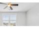 Bright bedroom features a ceiling fan, neutral carpet, and a double window that allows natural light to flood the space at 113 Grimball St, Summerville, SC 29486
