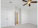 Spacious bedroom with a ceiling fan and neutral carpet offers a cozy retreat with a closet and ensuite access at 113 Grimball St, Summerville, SC 29486