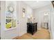 Inviting foyer with hardwood floors, natural light, and a convenient half bathroom off the entry at 113 Grimball St, Summerville, SC 29486
