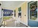 Welcoming front porch with rocking chairs, fresh paint, and beautiful wreath, ready to move in at 113 Grimball St, Summerville, SC 29486