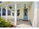 Inviting front porch with rocking chairs and hanging plants, perfect for relaxing and enjoying the outdoors at 113 Grimball St, Summerville, SC 29486