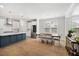 Bright, open kitchen with a large island, stainless appliances, and an adjacent dining and living area at 113 Grimball St, Summerville, SC 29486