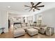 Bright living room showcasing the open floor plan connecting to the kitchen and dining area at 113 Grimball St, Summerville, SC 29486