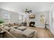 Inviting living room with a fireplace, comfortable sectional sofa, and bright, airy feel with ample windows at 113 Grimball St, Summerville, SC 29486