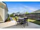 A charming backyard patio with a table and chairs, ideal for outdoor dining and entertaining at 113 Grimball St, Summerville, SC 29486