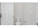 Clean powder room featuring a modern toilet, light gray paint, and a white door at 113 Grimball St, Summerville, SC 29486