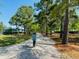A community walking path lined with mature trees offers a shaded route to explore and enjoy nature at 113 Grimball St, Summerville, SC 29486