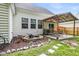 Charming backyard with stone fountain, patio area, and a covered structure perfect for outdoor entertaining at 117 Back Tee Cir, Summerville, SC 29485