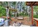 Outdoor living area with mature trees, a fire pit, comfortable seating, and a fun zipline at 117 Back Tee Cir, Summerville, SC 29485