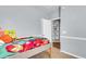 Comfortable bedroom with colorful bedding, decor, and built-in shelving at 117 Back Tee Cir, Summerville, SC 29485