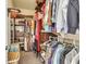 Spacious walk-in closet with custom wood shelving, hanging rods, and ample storage space at 117 Back Tee Cir, Summerville, SC 29485