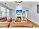 Comfortable living room features a fireplace, a cozy seating area, and plenty of natural light at 117 Back Tee Cir, Summerville, SC 29485