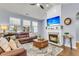Inviting living room featuring a fireplace, a comfortable seating area, and plenty of natural light at 117 Back Tee Cir, Summerville, SC 29485