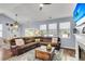 Open-concept living room with an inviting living space, ceiling fan and lots of natural light at 117 Back Tee Cir, Summerville, SC 29485
