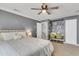 Inviting main bedroom featuring a tufted headboard, natural light, and sewing area at 117 Back Tee Cir, Summerville, SC 29485