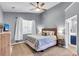 Comfortable main bedroom features neutral decor, a ceiling fan, and soft natural light at 117 Back Tee Cir, Summerville, SC 29485