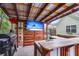 Awesome outdoor bar and entertainment area with a flat screen TV, grill, and backyard games at 117 Back Tee Cir, Summerville, SC 29485