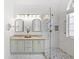 Updated bathroom with double vanity, glass shower, and stylish tile accents at 1177 Old Ivy Way, Mount Pleasant, SC 29466