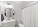 Bathroom features a clean white vanity, toilet, and shower with a curtain at 1177 Old Ivy Way, Mount Pleasant, SC 29466