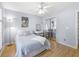 Inviting bedroom with a ceiling fan, desk, and closet with mirrored doors at 1177 Old Ivy Way, Mount Pleasant, SC 29466