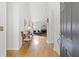 Bright entryway featuring hardwood floors, stylish furniture, and a clear view into the cozy living room with a fireplace at 1177 Old Ivy Way, Mount Pleasant, SC 29466