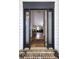 Inviting entryway with hardwood floors, a classic rug, and a glimpse into the bright and airy living space at 1177 Old Ivy Way, Mount Pleasant, SC 29466