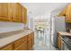 Bright kitchen with wooden cabinets, stone countertops, and an adjacent breakfast nook with a bay window offering scenic views at 1177 Old Ivy Way, Mount Pleasant, SC 29466