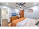 Bright bedroom with hardwood floors, a vintage dresser and a ceiling fan at 1188 Camden St, North Charleston, SC 29405