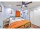 Charming bedroom with hardwood floors, colorful rug, fan and a closet at 1188 Camden St, North Charleston, SC 29405