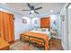 Cozy bedroom with hardwood floors, vintage bed frame, fan and light blue walls at 1188 Camden St, North Charleston, SC 29405