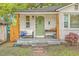 Inviting front porch with cozy seating and stylish decor, perfect for relaxing outdoors at 1188 Camden St, North Charleston, SC 29405