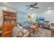 Cozy living room featuring hardwood floors, a bookshelf, and comfortable seating area with ample lighting at 1188 Camden St, North Charleston, SC 29405