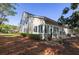Backyard with a patio, mature trees, lush lawn, and exterior view of the home at 120 Fresh Meadow Ln, Mount Pleasant, SC 29466