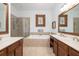Bright bathroom with double vanity, separate shower and bathtub, and a large decorative mirror on the back wall at 120 Fresh Meadow Ln, Mount Pleasant, SC 29466