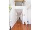 Inviting entryway with gleaming hardwood floors and an open staircase to the second level at 120 Fresh Meadow Ln, Mount Pleasant, SC 29466
