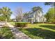 Charming two-story home with manicured lawn, mature trees, and green shrubs at 120 Fresh Meadow Ln, Mount Pleasant, SC 29466