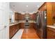 Well-equipped kitchen with stainless steel appliances, wood cabinets, and a view into the dining area at 120 Fresh Meadow Ln, Mount Pleasant, SC 29466
