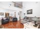 Open concept living area with hardwood floors and comfortable seating arrangement and view of the dining room at 120 Fresh Meadow Ln, Mount Pleasant, SC 29466